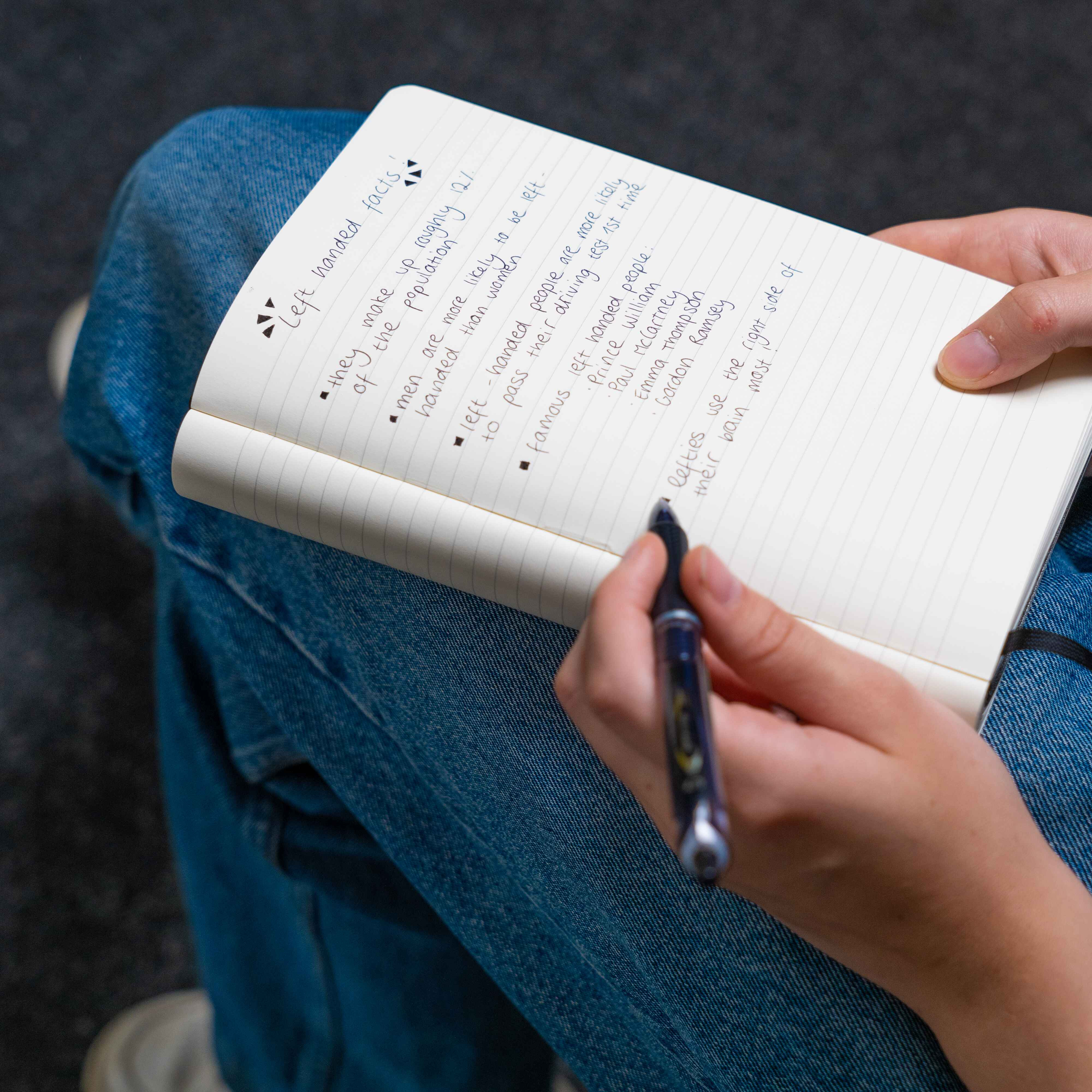 Left-handed student writing notes with a PILOT Acroball Hybrid Pen, showcasing its comfortable grip and quick-drying ink, ideal for left-handed students during HSC exams.