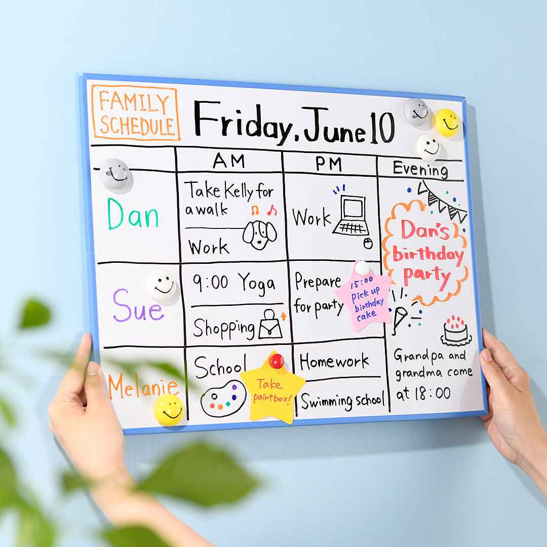 Hands holding a whiteboard with a colourful family schedule written in PILOT V Board Master markers, demonstrating the markers' vibrancy and suitability as the best whiteboard marker for home organisation.