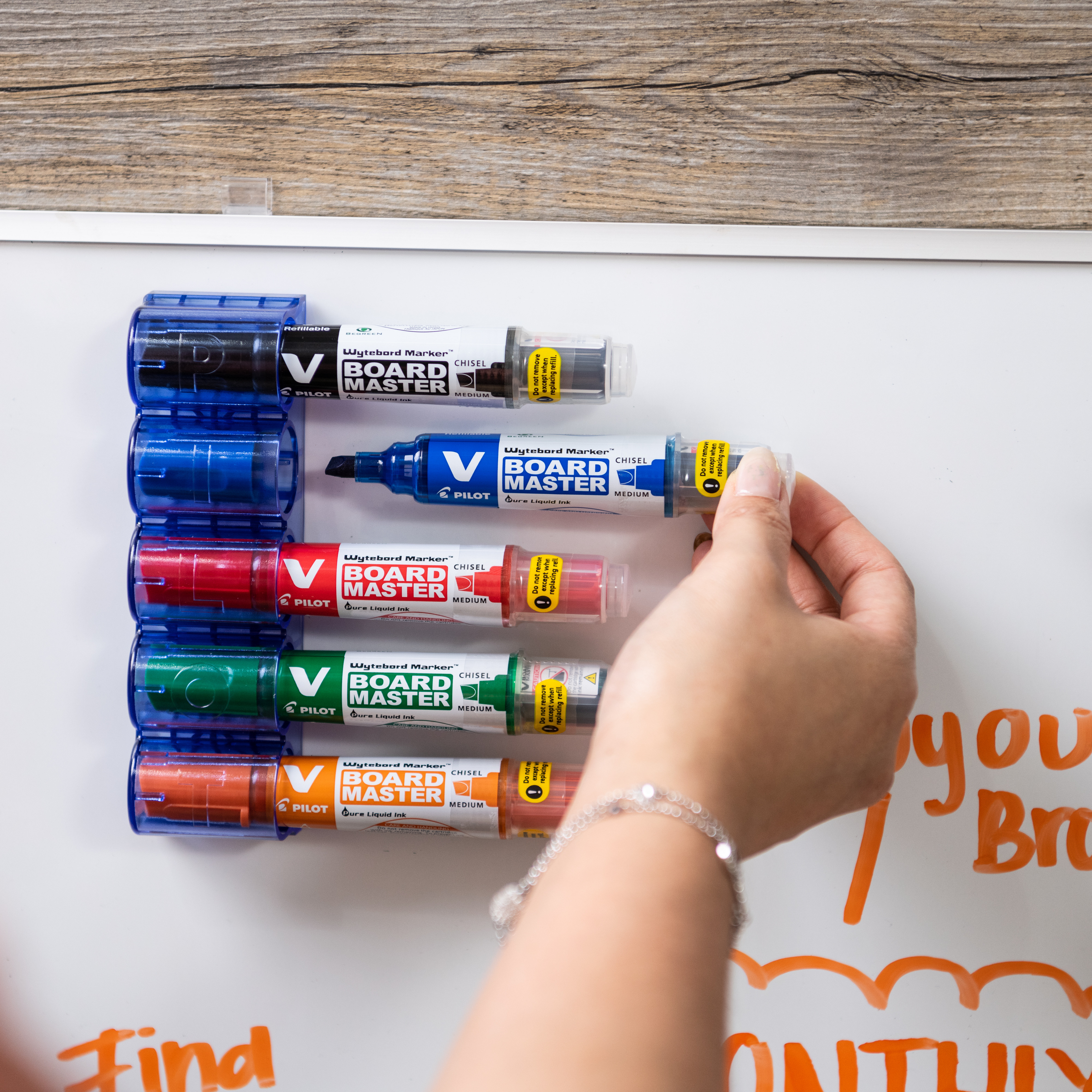 Pilot V Board Master markers arranged in a holder with vibrant colours, a sustainable choice for eco-conscious offices and schools.