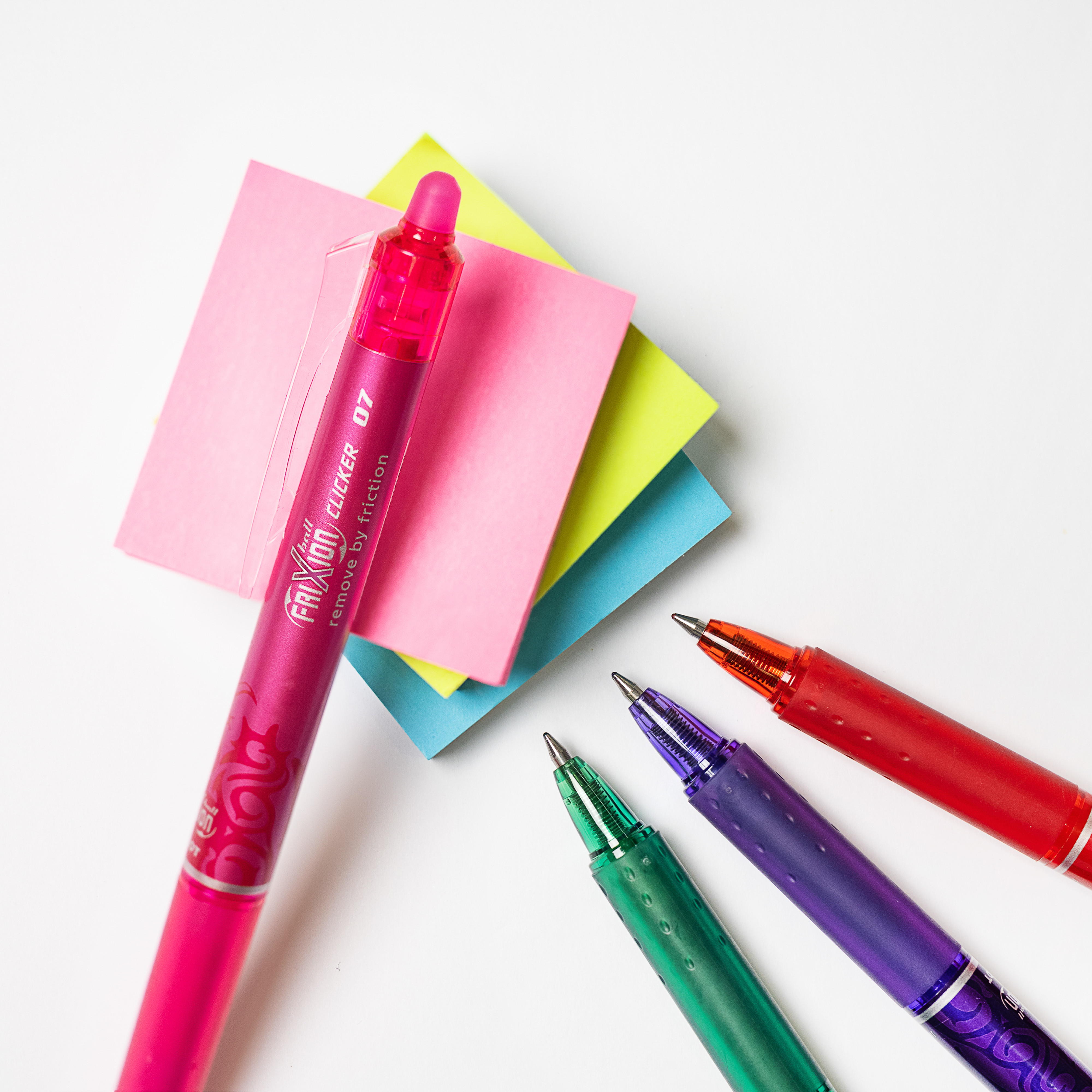 Pink PILOT FriXion Erasable Clicker with coloured sticky notes, planning how to write thank you notes.