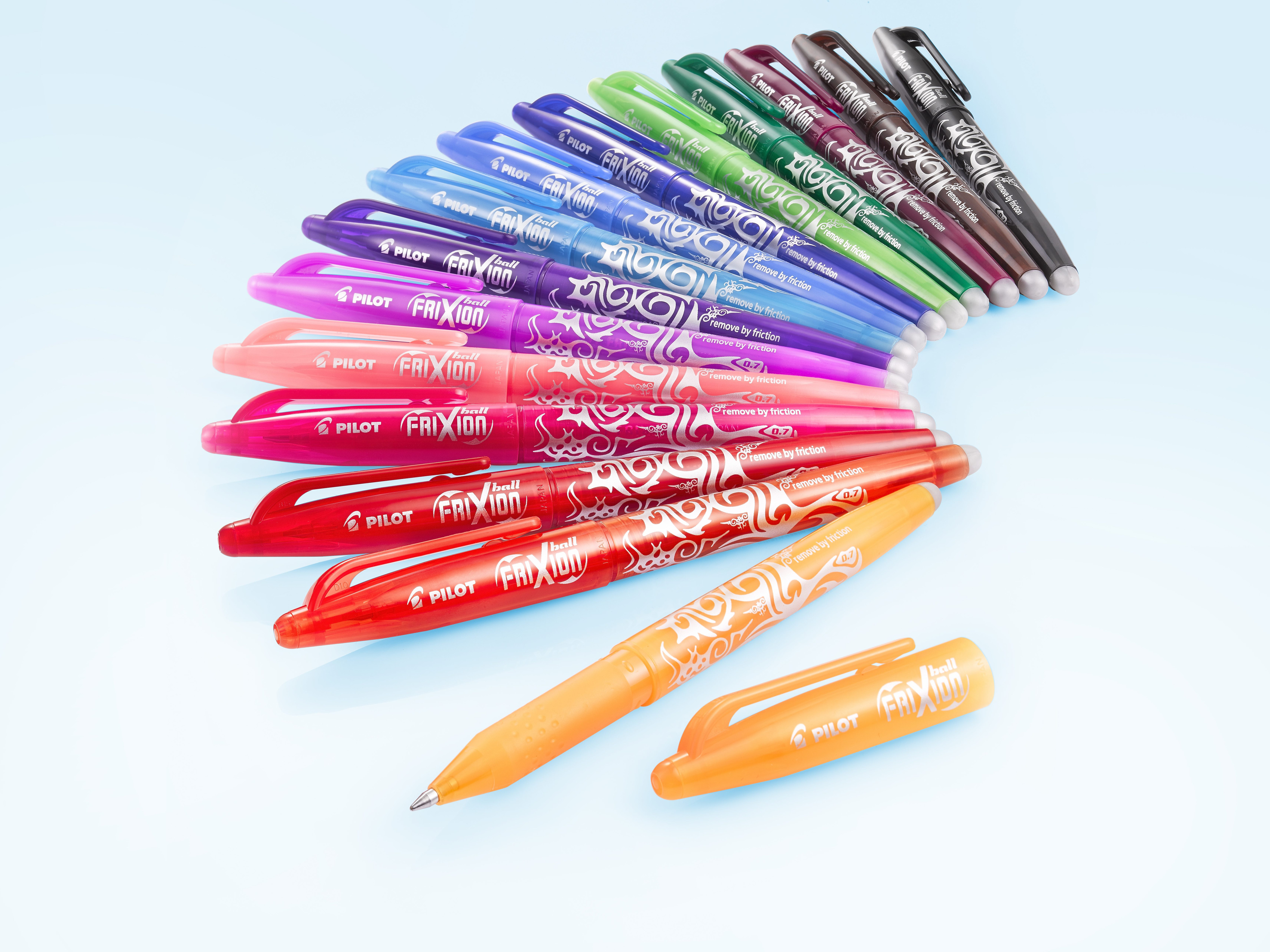The full range of colourful FriXion erasable pens displayed in a rainbow