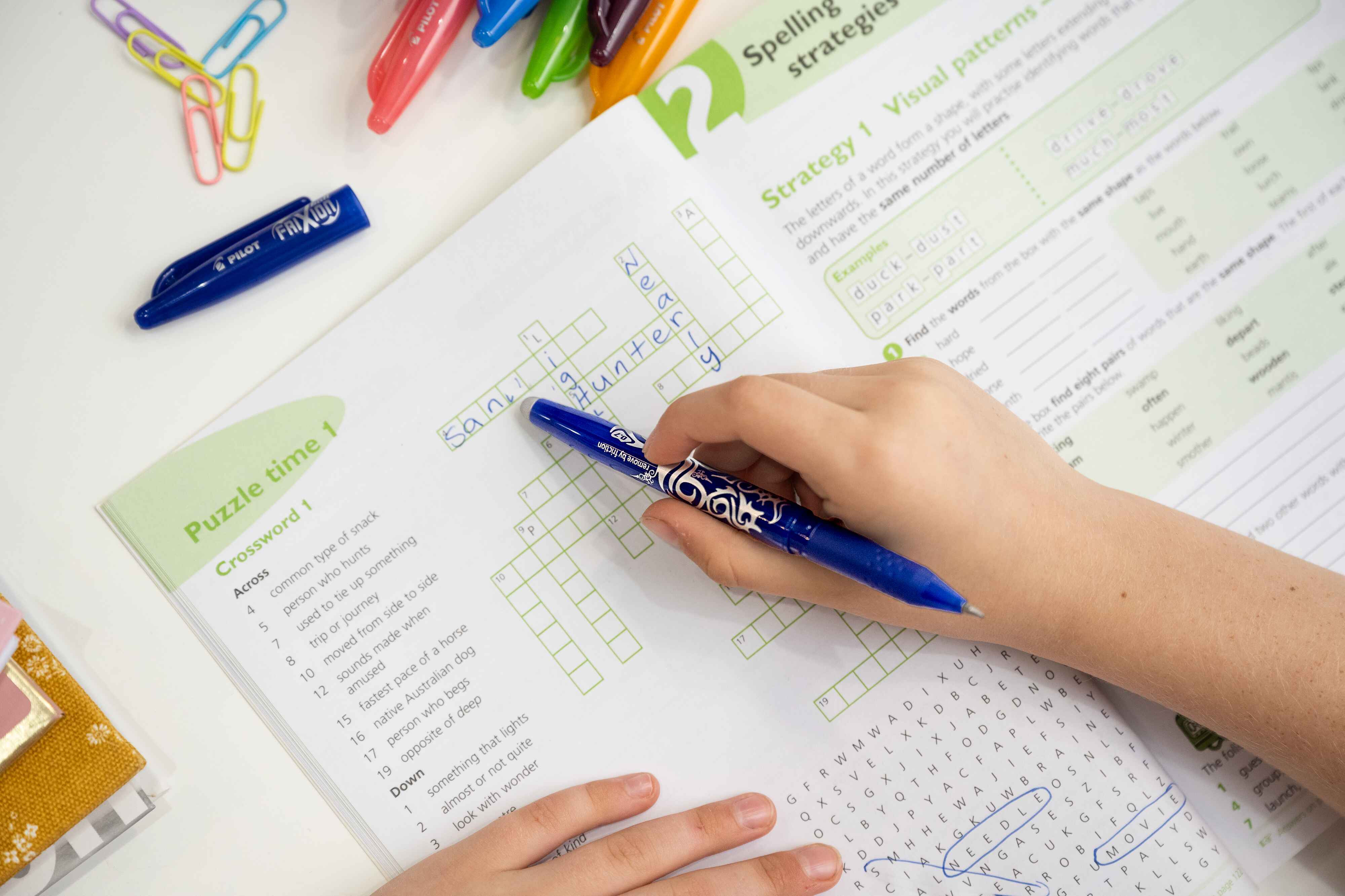 A Erasable Gel Pen erasing and error in a crossword puzzle.