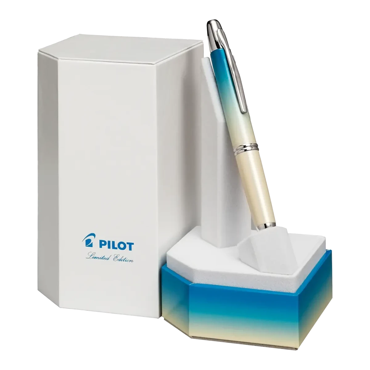 A PILOT Capless retractable fountain pen, featuring an ombre design that transitions from turquoise to white, displayed upright in a giftbox featuring the same ombre design.